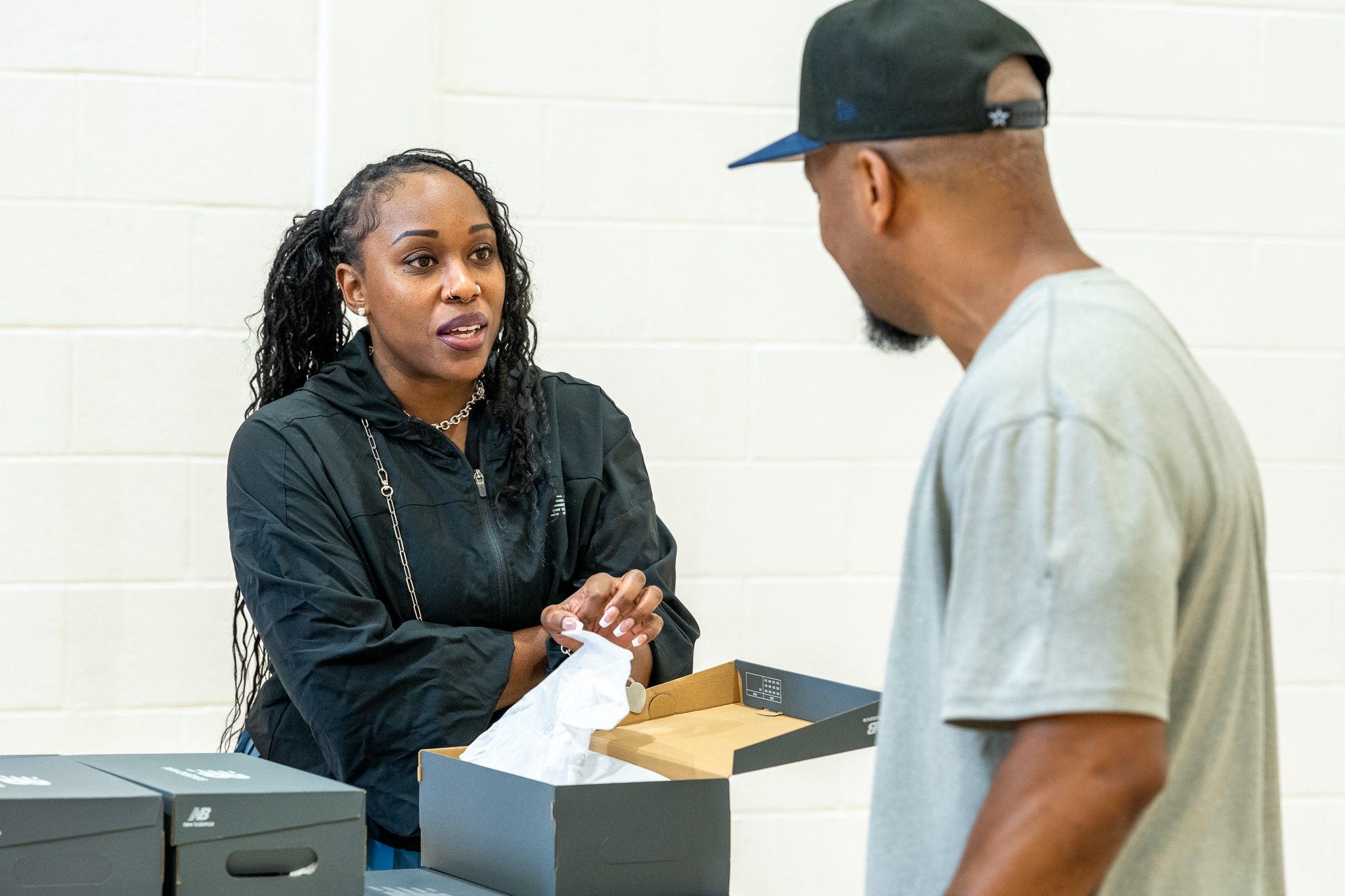 Arkia Allen spent the afternoon at the shoe table, where every pair was distributed.
