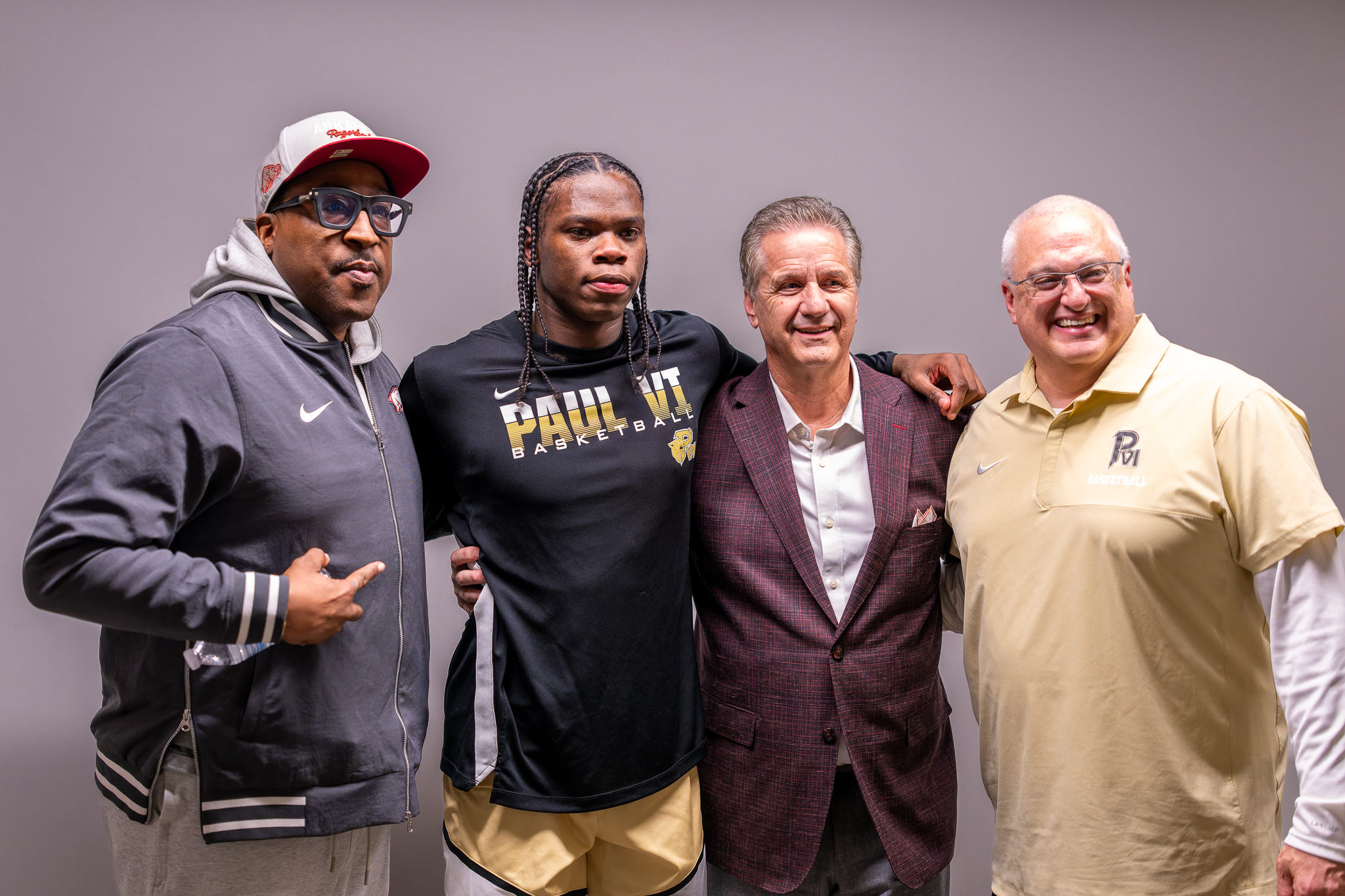 Smith announced his commitment to Arkansas before Paul VI's senior night game, where Razorbacks coach John Calipari, second from right, made a surprise appearance.