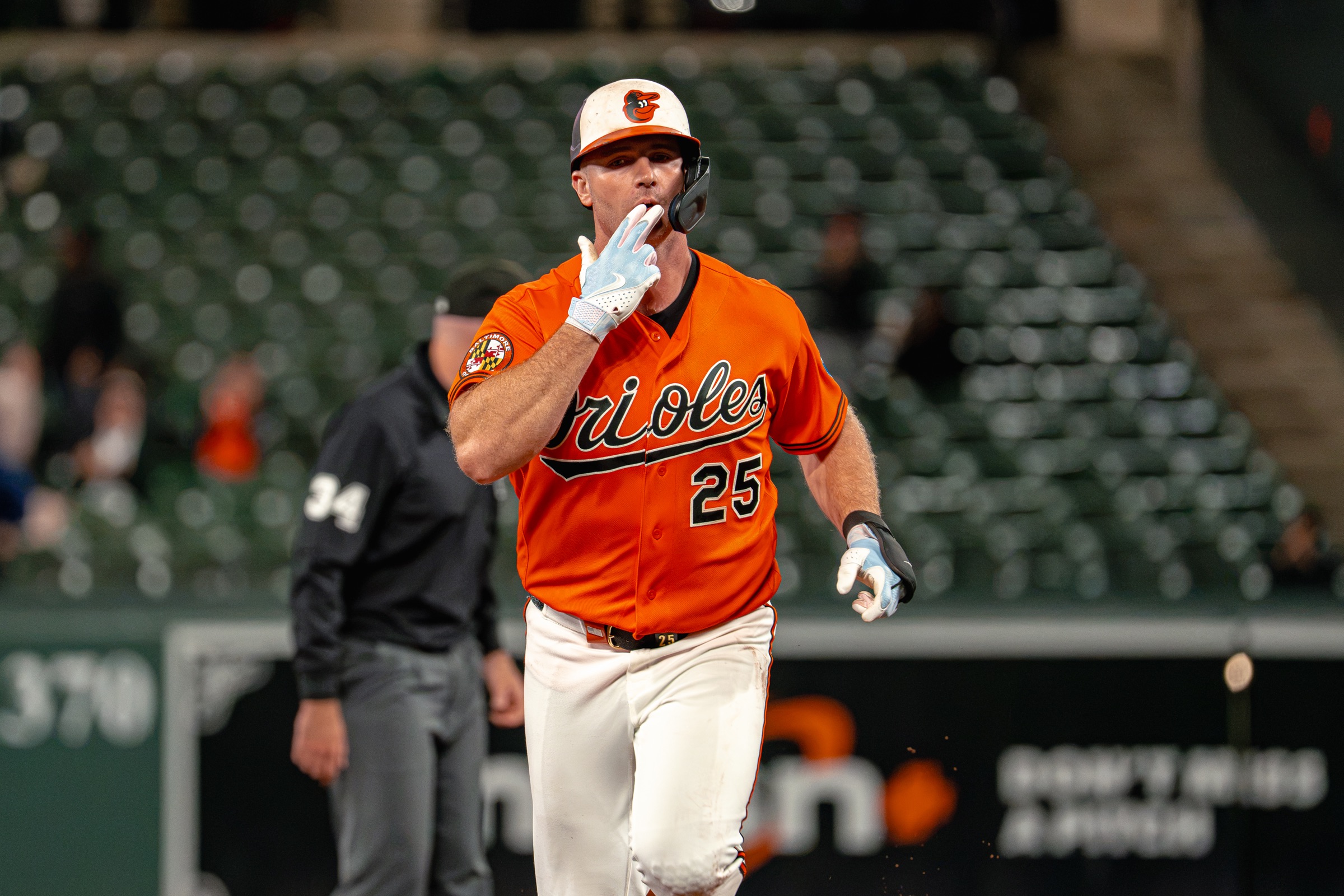Pete Alonso in an orange Orioles jersey rounds the bases against Toronto