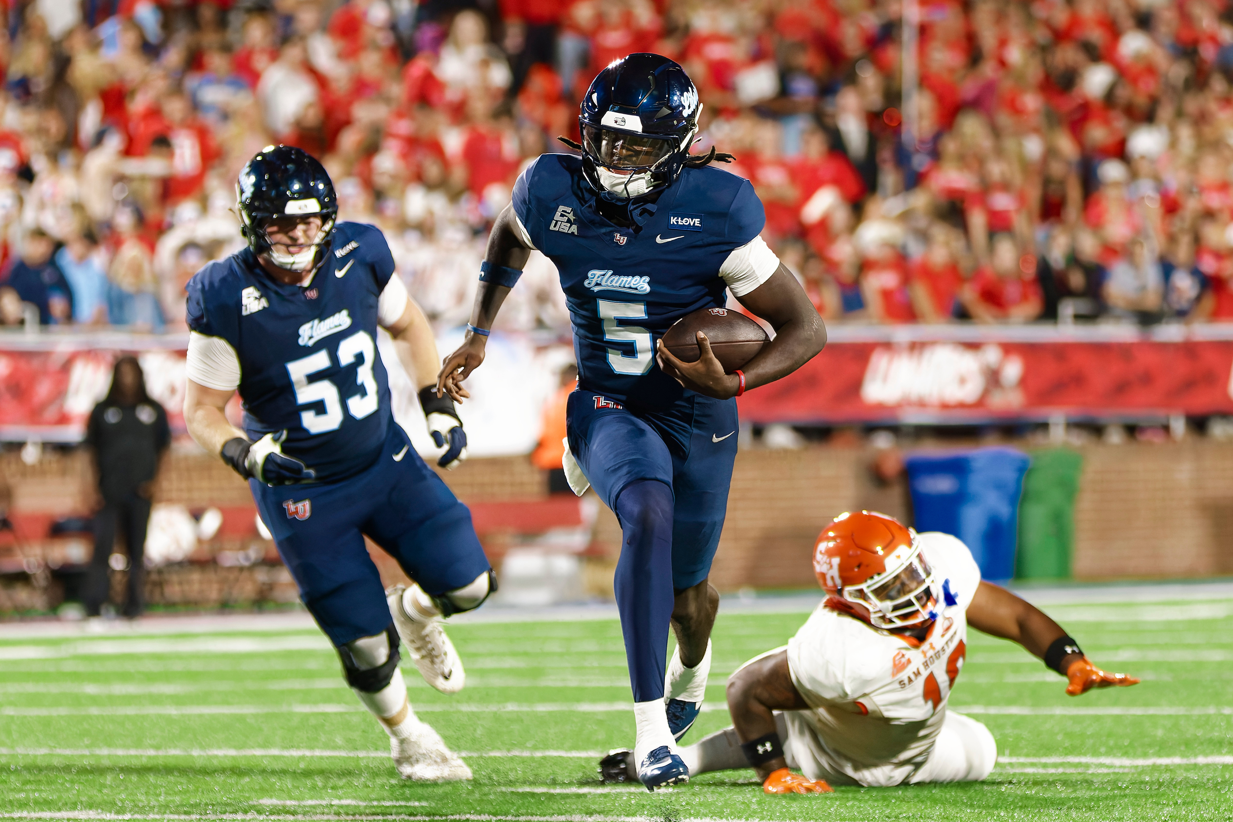 Liberty runner carries the ball upfield