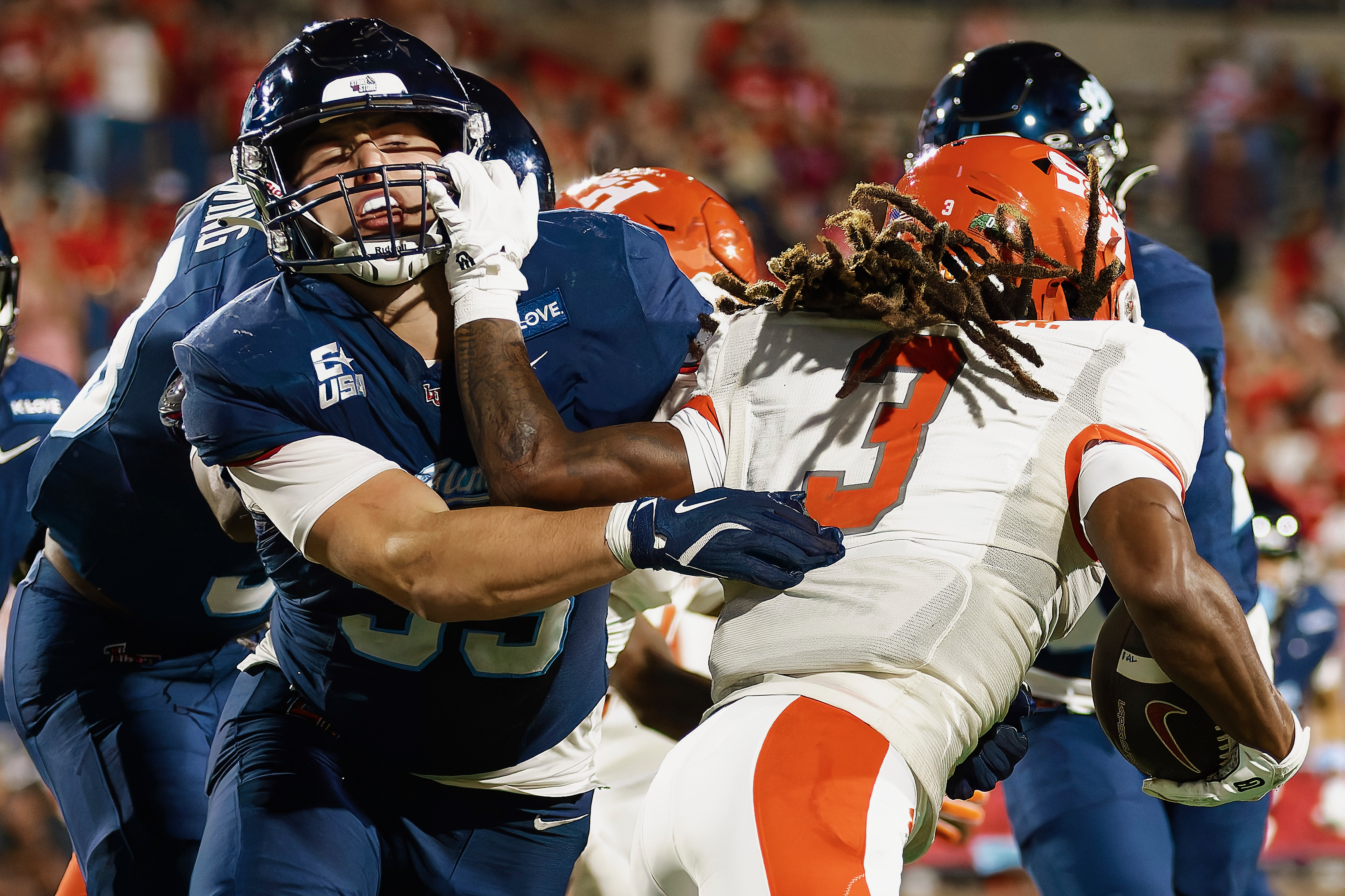 Liberty defender engages a Sam Houston ballcarrier
