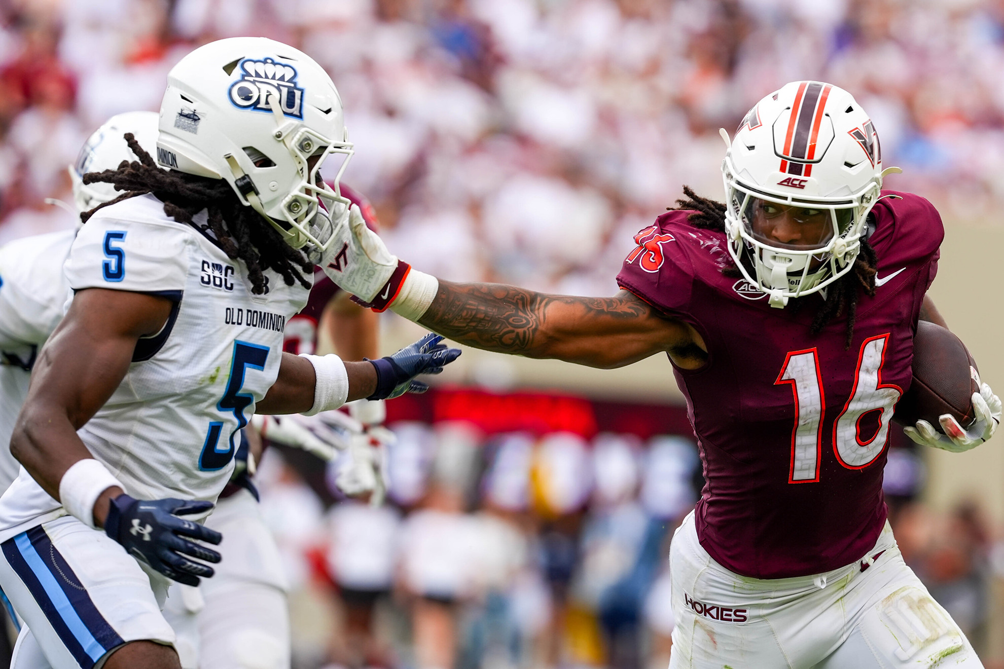 Virginia Tech running back Jeffrey Overton Jr. stiff-arms an Old Dominion defender at Lane Stadium on September 12, 2026.