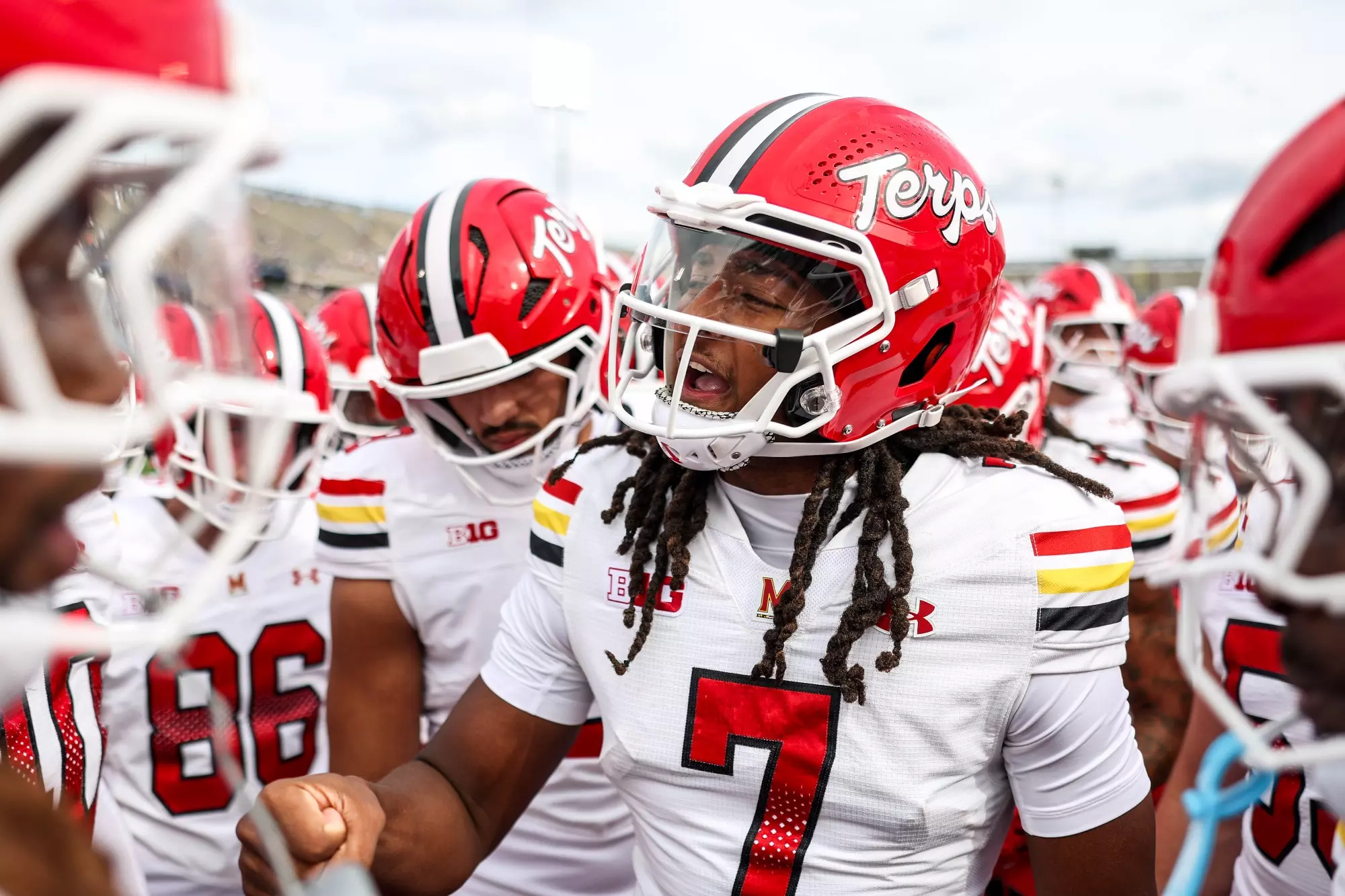 Maryland quarterback Malik Washington gathers with teammates at the UConn game. September 12, 2026, East Hartford, Connecticut.