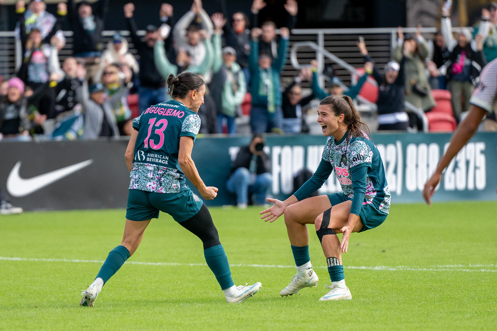 Lucia Di Guglielmo (13) celebrates with Sofia Cantore (27) against Gotham FC.