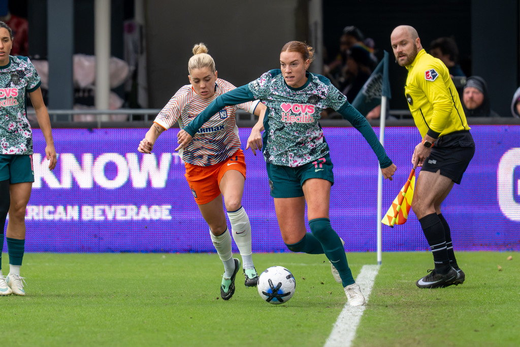 Washington Spirit carries the ball along the touchline against Gotham FC.