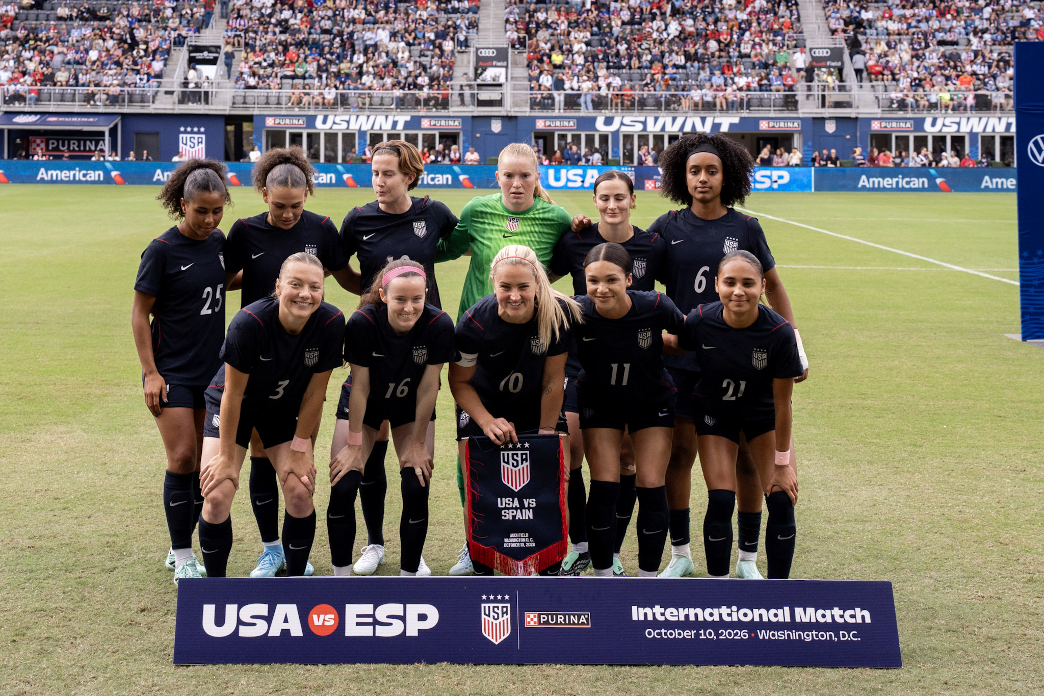 The United States starting XI poses together before the Spain match at Audi Field on October 10.